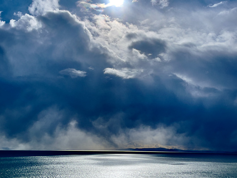Moody cloudscape with vibrant blue pantones over Ocean