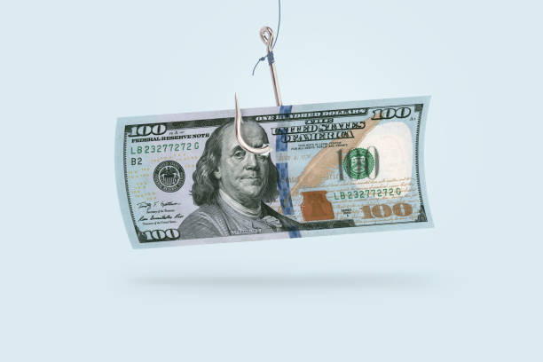 istock 100 dollars on a hook, creative idea. Business and scam projects, concept. Scammers 2046101475