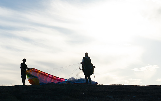 Paragliding class. Backlit photo with copy space