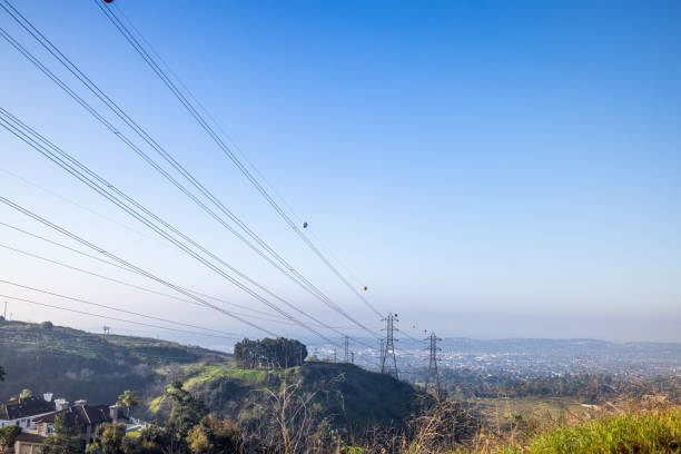 A worker for energy company at the transmission tower