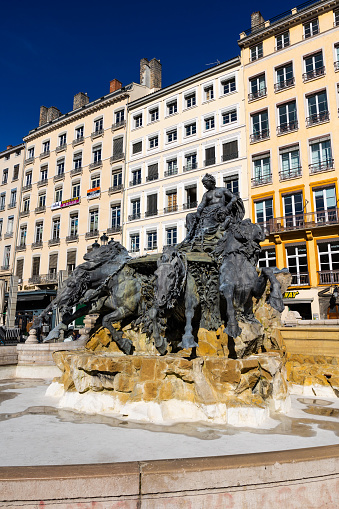 Bronze sculpture of the Bartholdi Fountain in the middle of Place des Terreaux in Lyon