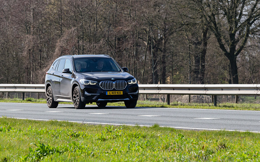 Crozon, France - May 29th, 2018: Bmw motor company badge on the front from a black car. BMW is a German automobile, motorcycle and engine manufacturing company founded in 1916.