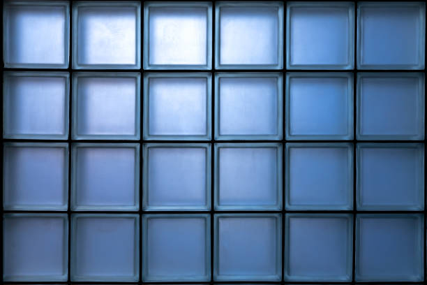 istock Window is made of a blue glass block glowing from the inside. Glass block wall pattern. 2046153589