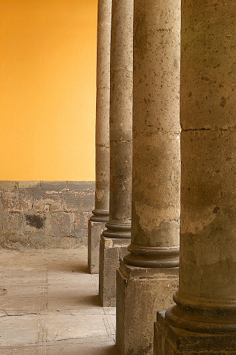 Set of classic concrete columns, interior building perspective, pillars detail with yellow background