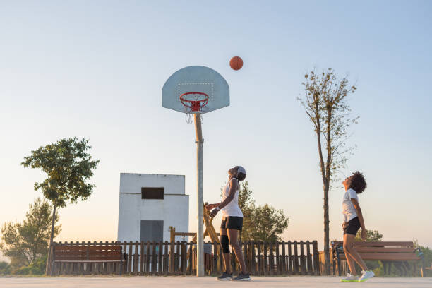 istock Mother playing basketball with his son 2046202836