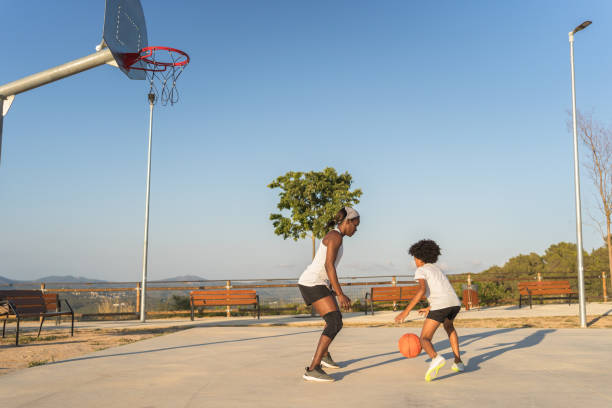 istock Single-parent family playing basketball 2046204937