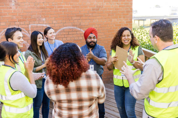 istock Diverse group of colleagues smile and celebrate their peer 2046206552