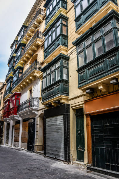 istock Stacked Bay Windows Over Old Cobblestone Streets in Valetta, Malta 2046215916