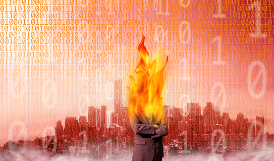Conceptual business and finance image of burning businessman