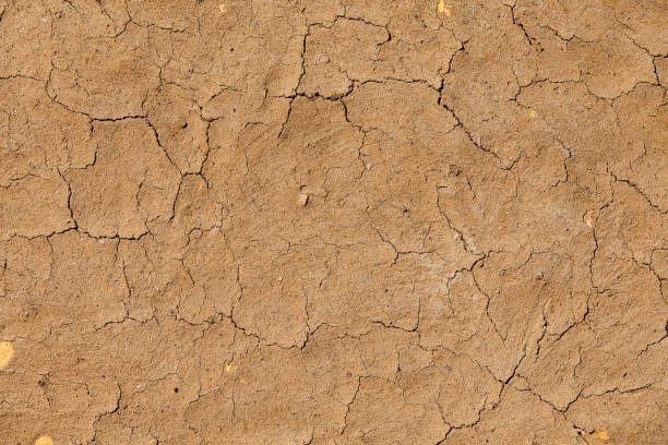 Old clay wall as abstract grunge background with space for text or image