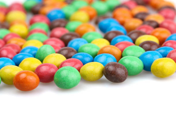 istock Chocolate dragee. Chocolate coated with colorful candies. Selective focus. 2046237975
