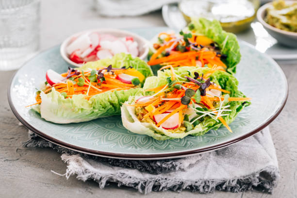 istock Vegan lettuce wraps with vegetables, avocado spread and microgreens, healthy snack 2046244986