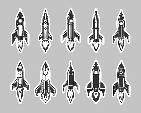 Set of space rockets and shuttles. Icons, stickers. Black and white silhouettes. Vector