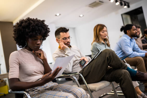 istock Group of multiethnic business people waiting for job interview. 2046250331