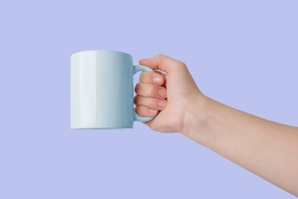 istock Cup with clean surface for logo promotion on a purple background 2046277487