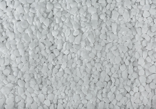Coarse salt texture, as background. Crystal sea salt, top view.