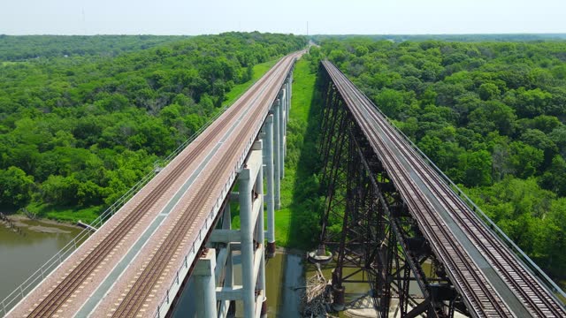 Two Railroad Trestle Bridges Over River