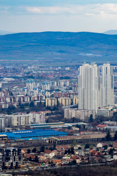 European mountain city seen from above at sunset on a cloudy day, Skopje the capital city. European mountain city seen from above at sunset on a cloudy day, Skopje the capital city. bursa ofis tadilatı stock pictures, royalty-free photos & images