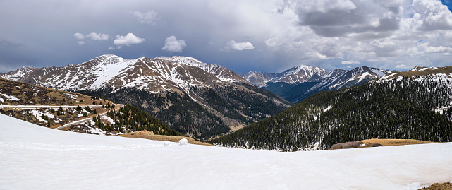 A panoramic view at the summit of Independence Pass (12,095 ft), looking towards east, on a stormy Spring day. Colorado, USA.