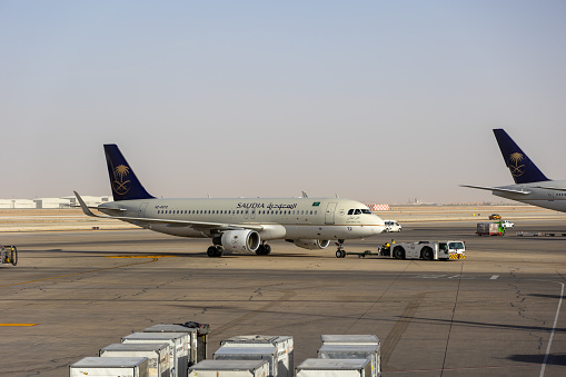 Riyadh, Saudi Arabia - February 25, 2024 : Saudia Airbus A320 at King Khalid International Airport in Riyadh, Saudi Arabia.