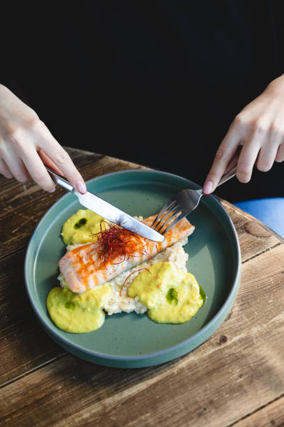 istock Salmon steak with avocado and spinach sauce. 2046314171