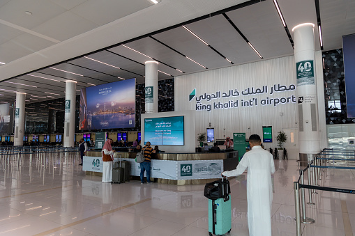 Riyadh, Saudi Arabia - February 25, 2024 : People at the King Khalid International Airport in Riyadh, Saudi Arabia.