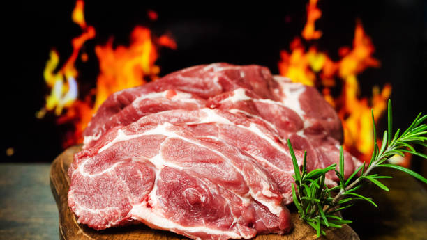 istock Grilled Pork Steaks on Fiery Background 2046329914