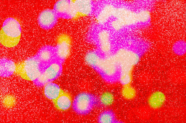 Abstract defocused bokeh lights blur sparkling red background Shining lights Party sparks glowing soft focus New Year Blurred texture Space abstract motion illustration Christmas