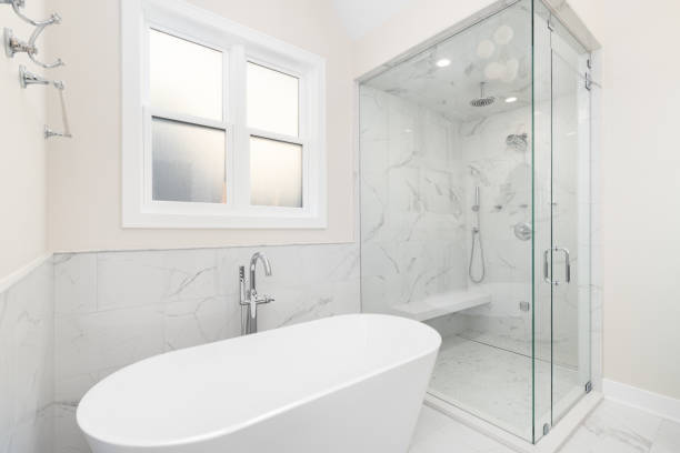 istock A bathroom with a freestanding tub and marble walk-in shower. 2046402142