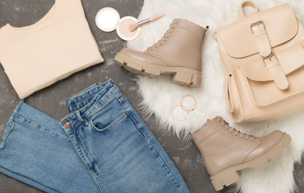 istock Flat lay with trendy spring outfit on concrete background, top view 2046432750
