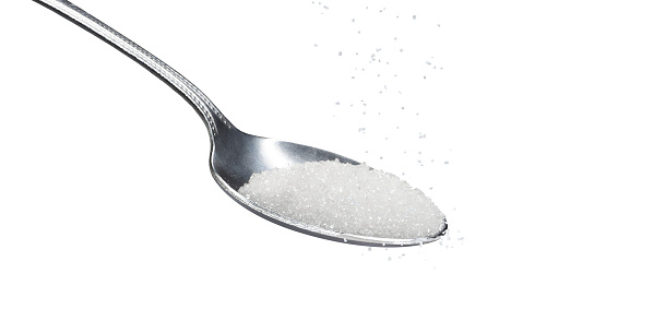 spoon of sugar on white background