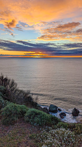 istock Gorgeous, vibrant multicolored California coast sunset over the Pacific Ocean 2046441093