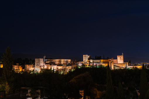Panorama view of the Alhambra in Granada on a clear Spring night, a palace and fortress complex that remains one of the most famous monuments of Islamic architecture.