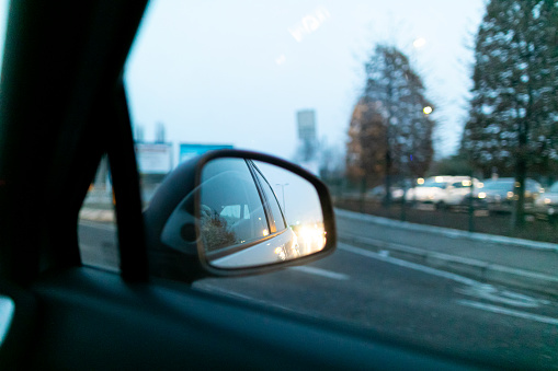 View of the car rearview mirror while driving