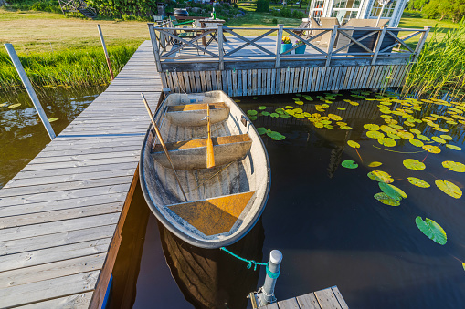 Beautiful view of typical private boat dock on a lake in Sweden.