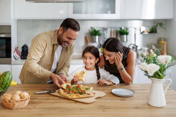 istock Family pizza dinner at home 2046559057