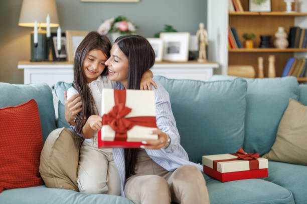 istock Daughter presents mother with Mother's Day gift 2046559561