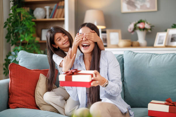istock Daughter presents mother with Mother's Day gift 2046560088