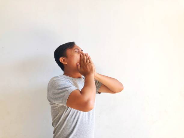 istock sick man coughing isolated white 2046585141