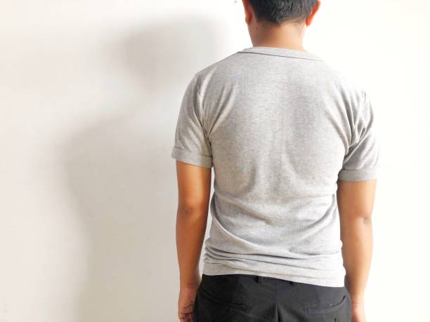 istock man contemplating with his back to the camera isolated on white 2046585706