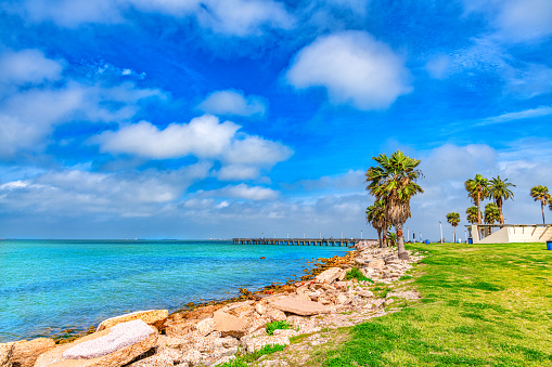 The coastline and public fishing pier at Seawolf Park located on Pelican Island, Galveston.