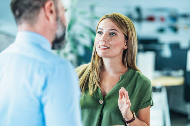istock Business colleagues talking in the office 2046709858