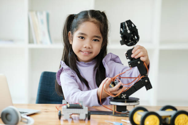 istock STEM education concept. Asian young girl learning robot design. 2046727110
