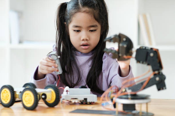 istock STEM education concept. Asian young girl learning robot design. 2046727112