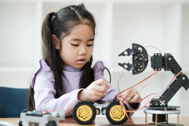 istock STEM education concept. Asian young girl learning robot design. 2046727113
