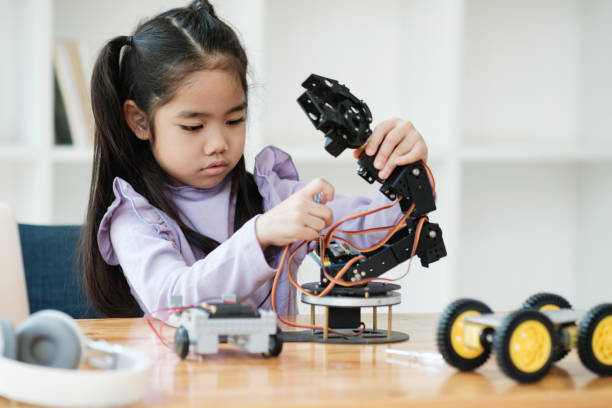 istock STEM education concept. Asian young girl learning robot design. 2046727116