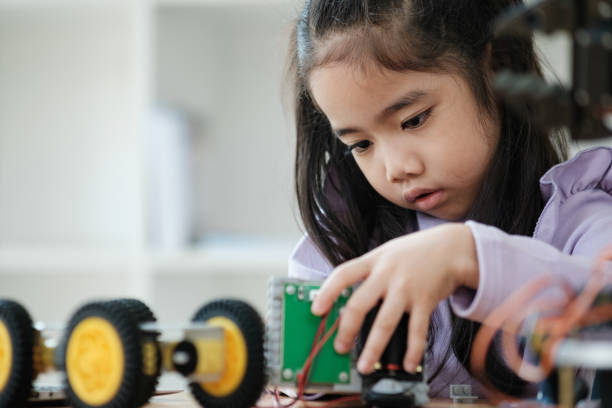istock STEM education concept. Asian young girl learning robot design. 2046727121