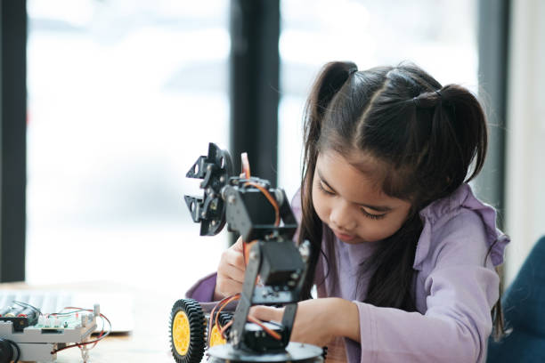 istock STEM education concept. Asian young girl learning robot design. 2046727122