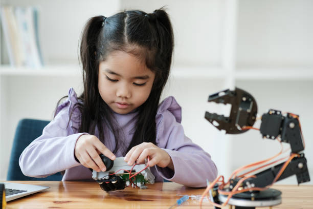 istock STEM education concept. Asian young girl learning robot design. 2046727123