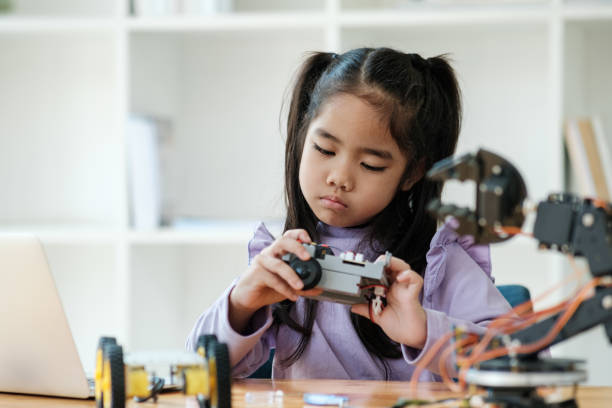 istock STEM education concept. Asian young girl learning robot design. 2046727124